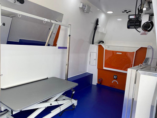 highlighting a blue floor and essential medical equipment for emergencies.